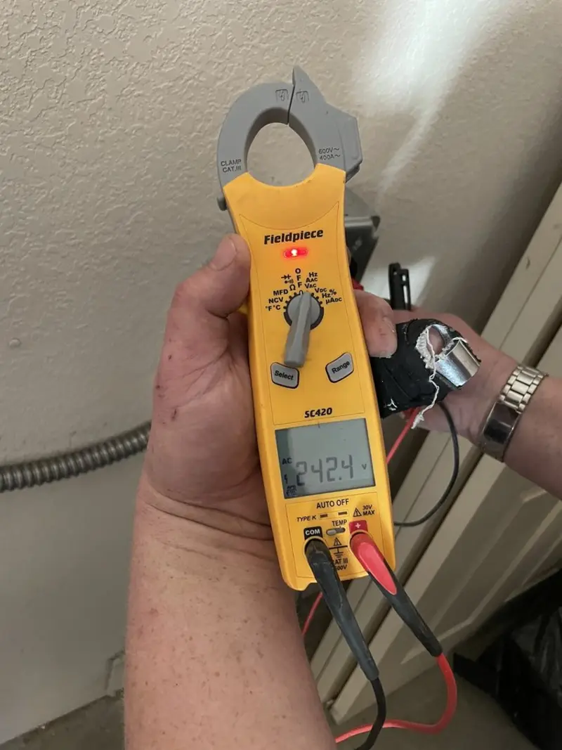 Voltage testing with clamp meter during Electrical Installation Services in Ramona